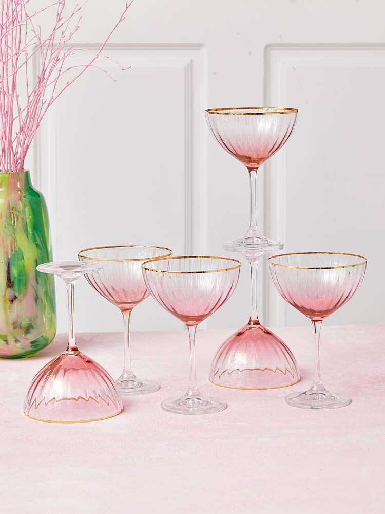 Kate-seriens champagneglas eller champagneskålar i rosa med guldkant