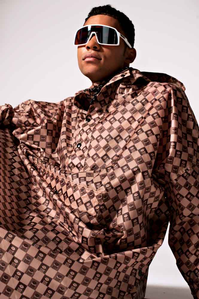 Rainkiss Rain Poncho i återvunnen plast Digi Damier i brun