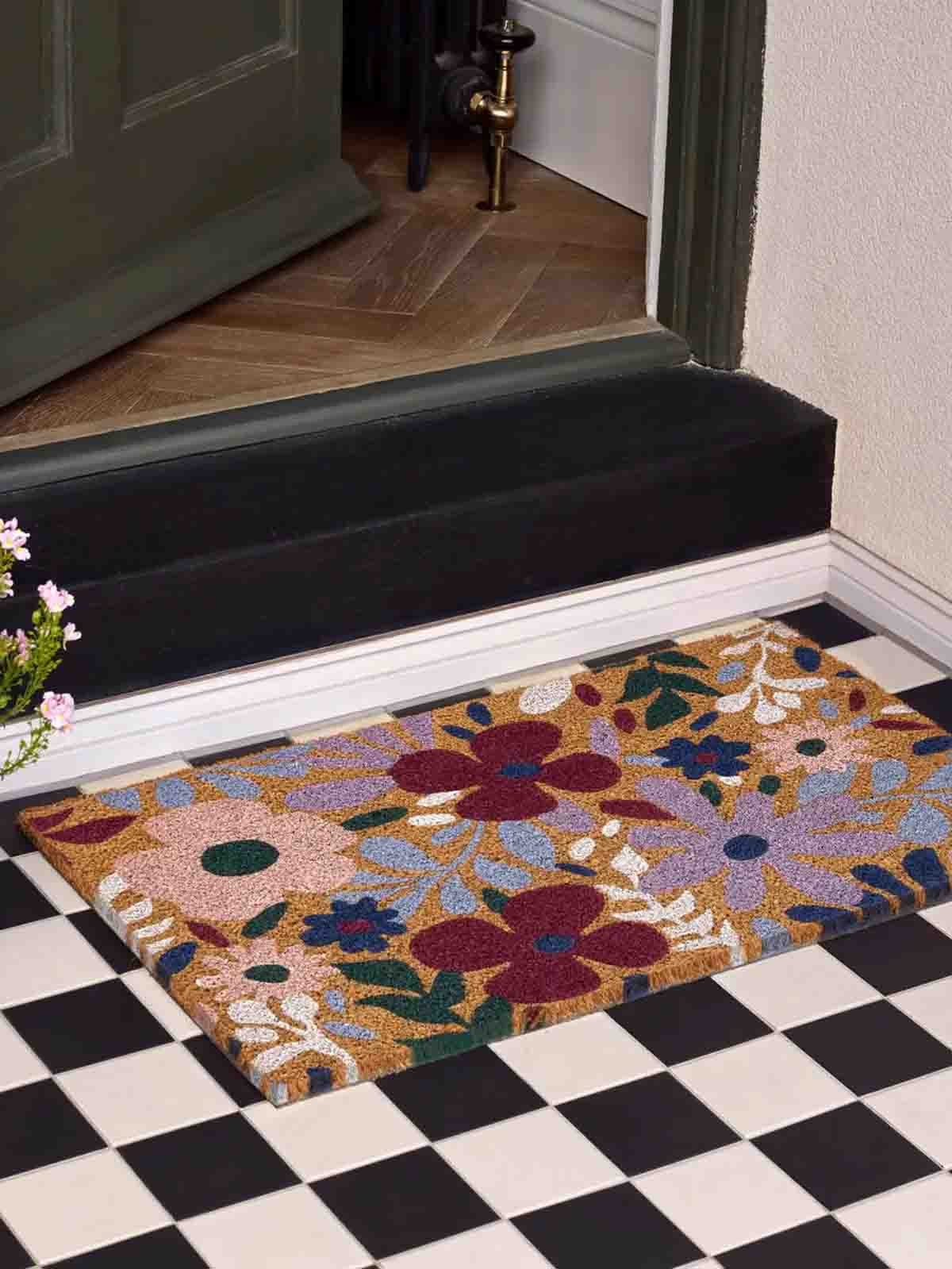 dörrmatta blommor i lila och vinrött